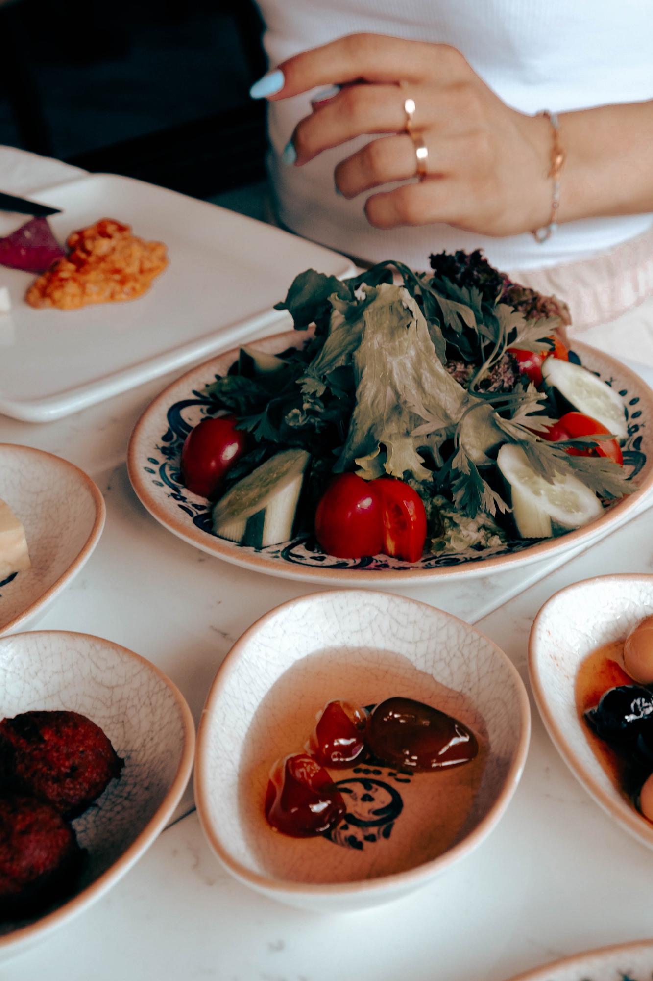 Large editorial shot of plated seasonal dish on a table